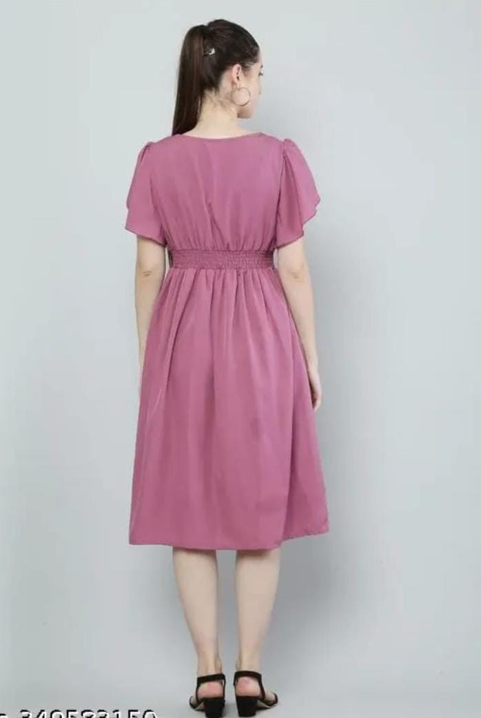 Pink fit-and-flare dress with gathered waist and short flutter sleeves, back view