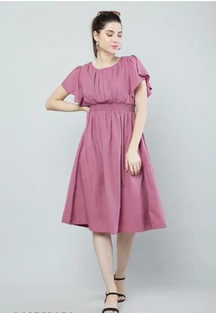 Pink babydoll dress with ruffled cap sleeves, gathered waist, and flared skirt