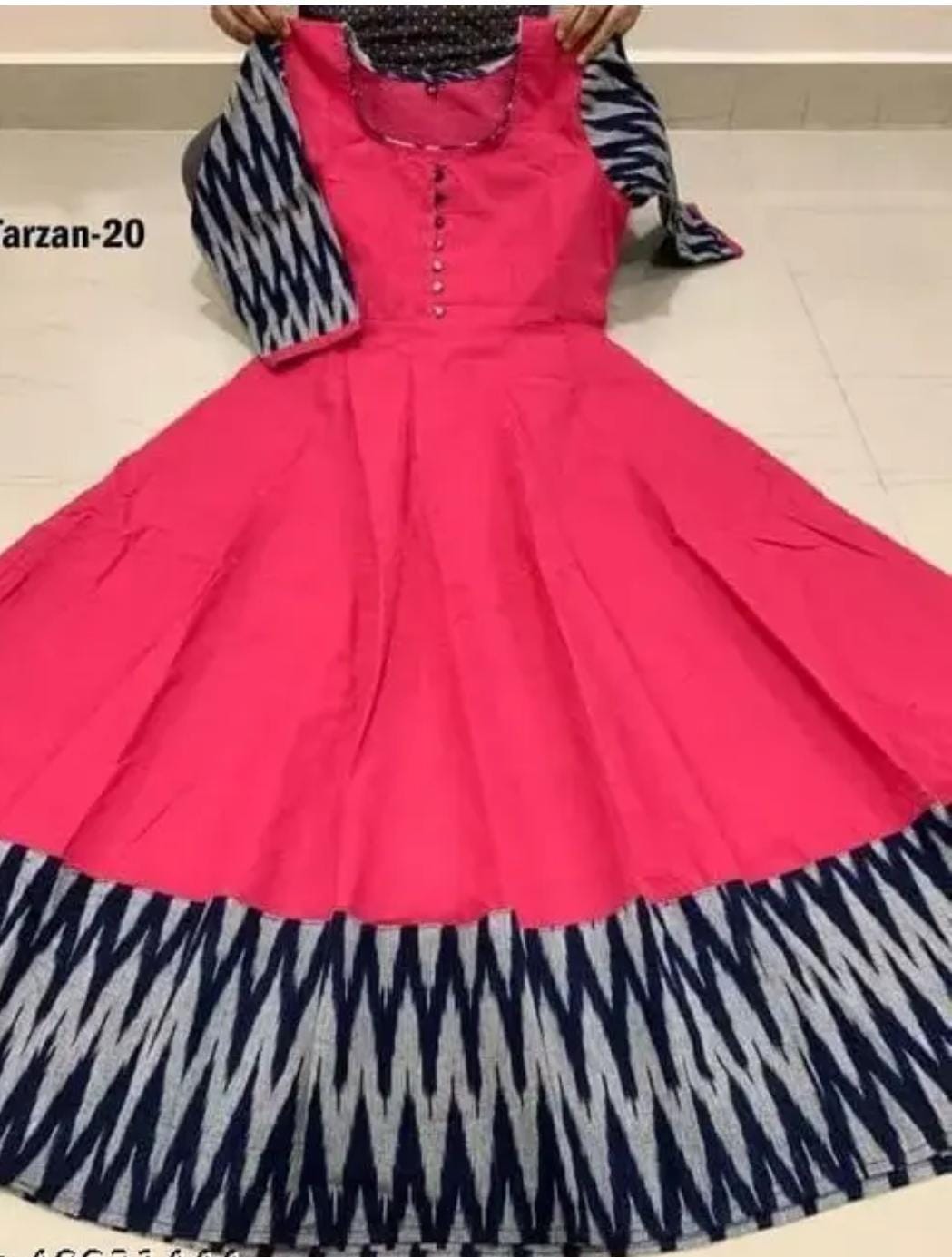 Red cotton flared gown with buttoned bodice, zigzag trim at hem and sleeves