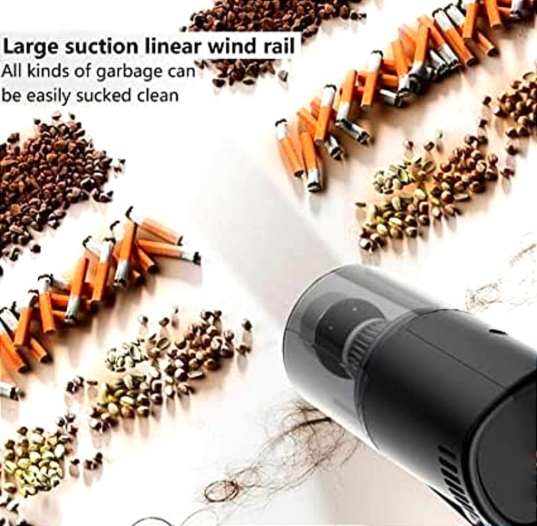 Handheld vacuum blower with long nozzle, shown clearing small debris from hard surfaces