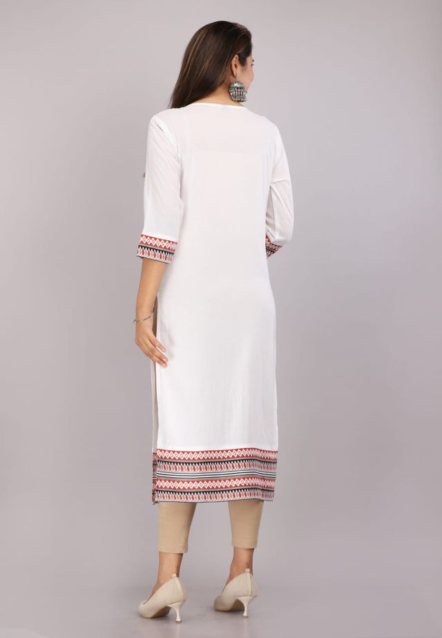Women's white kurti back view with patterned sleeve cuffs and red-blue hem border
