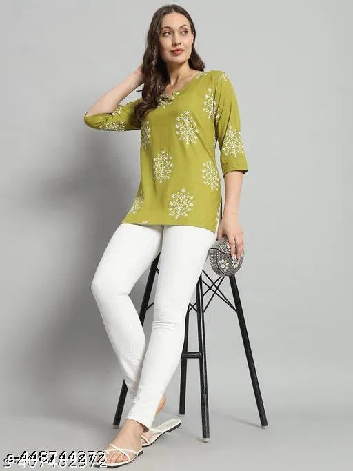 Green printed rayon short kurti with three-quarter sleeves and white motif patterns