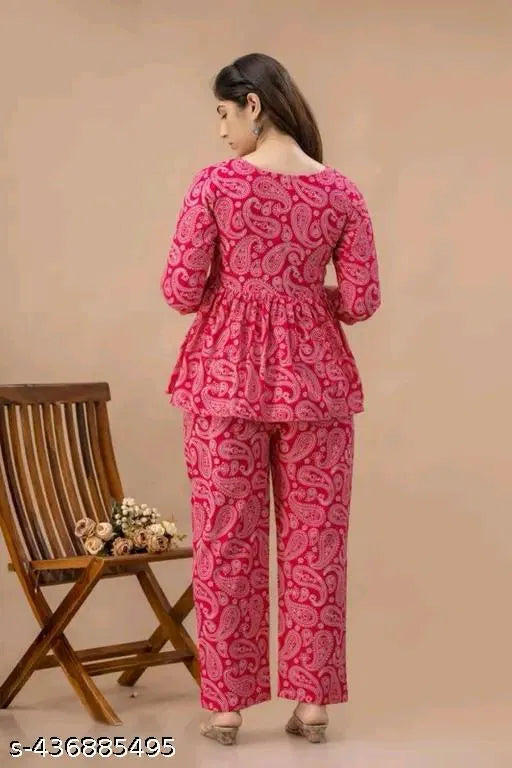 Pink printed co-ord set with 3/4 sleeve peplum top and wide-leg pants, back view