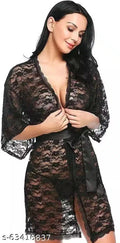 Black lace babydoll dress with V-neck, long sleeves, and sheer bodice