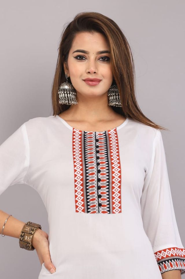Women's white kurti neckline with red-blue vertical embroidery and patterned sleeve cuff